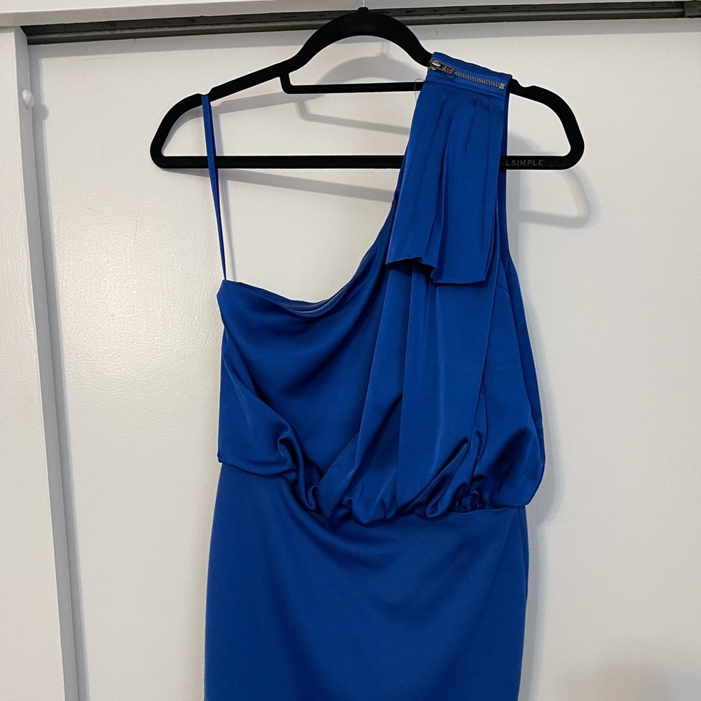 Blue one shoulder dress.
